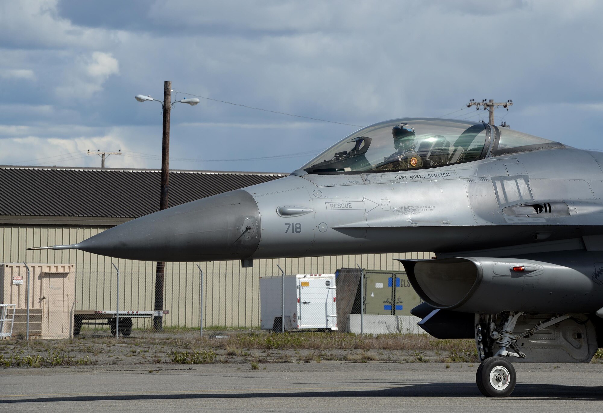 A U.S. Air Force F-16 Fighting Falcon assigned to the 80th Fighter Squadron out of Kunsan Air Base, Republic of Korea, looks on as he taxis along the Eielson Air Force Base, Alaska, flight line May 4, 2016, in preparation for a RED FLAG-Alaska (RF-A) 16-1 afternoon mission. RF-A is a series of Pacific Air Forces commander-directed field training exercises for U.S. and partner nation forces, enabling joint and international units to sharpen their combat skills by flying simulated combat sorties in a realistic threat environment inside the Joint Pacific Alaska Range Complex, the largest instrumented air, ground and electronic combat training range in the world. (U.S. Air Force photo by Master Sgt. Karen J. Tomasik/Released)