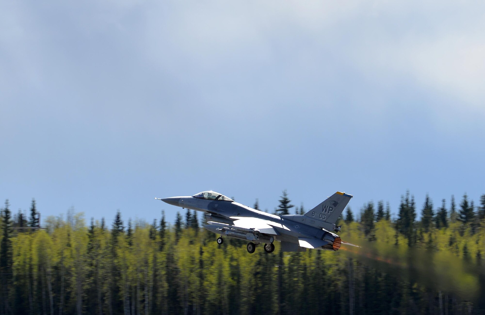 A U.S. Air Force F-16 Fighting Falcon assigned to the 80th Fighter Squadron out of Kunsan Air Base, Republic of Korea, takes off from Eielson Air Force Base, Alaska, May 4, 2016, during RED FLAG-Alaska (RF-A) 16-1. Wolf Pack pilots can sharpen their combat skills in the Joint Pacific Alaska Range Complex, which provides more than 67,000 square miles of airspace, one conventional bombing range and two tactical bombing ranges containing 510 different types of targets and 45 threat simulators, both manned and unmanned. (U.S. Air Force photo by Master Sgt. Karen J. Tomasik/Released)