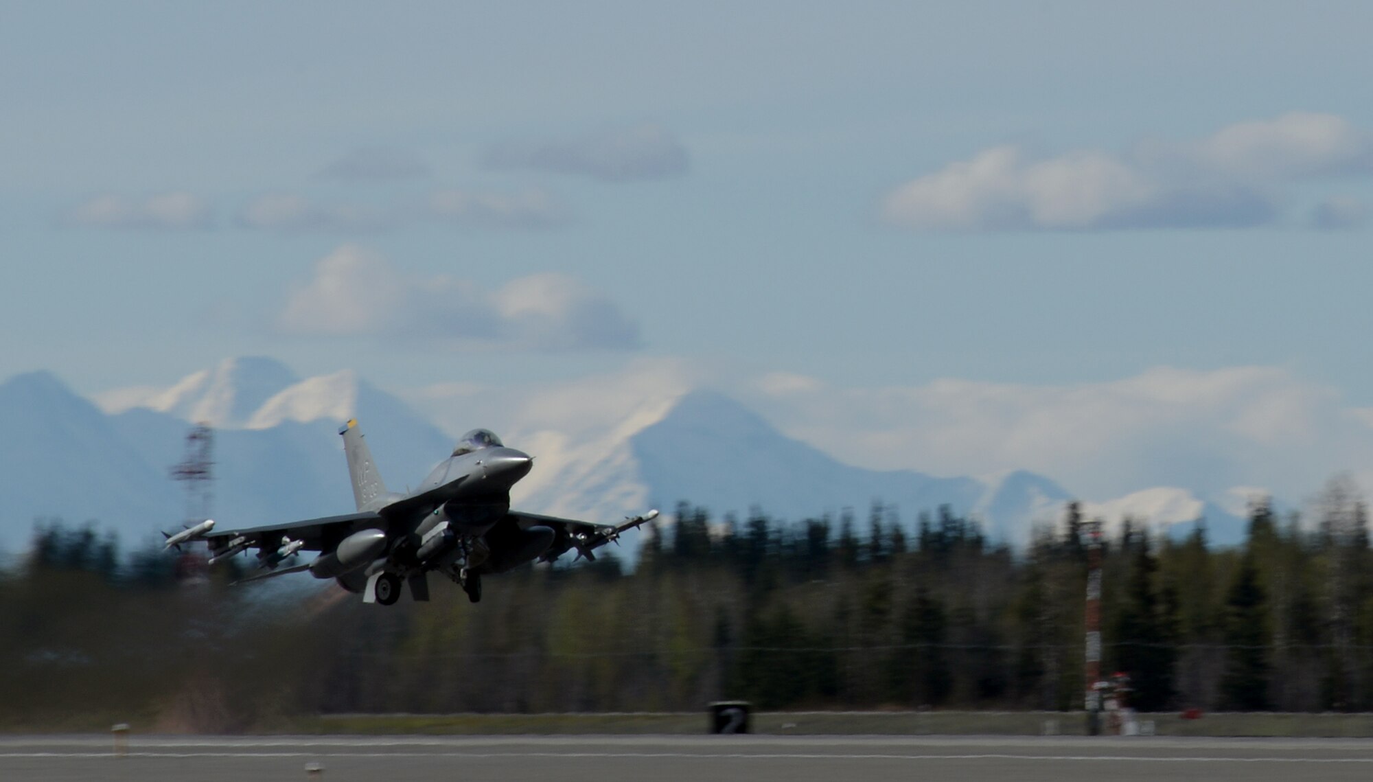 A U.S. Air Force F-16 Fighting Falcon assigned to the 80th Fighter Squadron out of Kunsan Air Base, Republic of Korea, takes off from Eielson Air Force Base, Alaska, May 2, 2016, during RED FLAG-Alaska (RF-A) 16-1. RF-A is a series of Pacific Air Forces commander-directed field training exercises for U.S. and partner nation forces, enabling joint and international units to sharpen their combat skills by flying simulated combat sorties in a realistic threat environment inside the Joint Pacific Alaska Range Complex, the largest instrumented air, ground and electronic combat training range in the world. (U.S. Air Force photo by Master Sgt. Karen J. Tomasik/Released)
