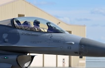 A U.S. Air Force F-16 Fighting Falcon pilot assigned to the 80th Fighter Squadron out of Kunsan Air Base, Republic of Korea, taxis down the Eielson Air Force Base, Alaska, flight line May 5, 2016, in preparation for a RED FLAG-Alaska (RF-A) 16-1 afternoon mission. RF-A is a series of Pacific Air Forces commander-directed field training exercises for U.S. and partner nation forces, enabling joint and international units to exchange tactics, techniques and procedures while improving interoperability in a realistic threat environment inside 67,000 square miles of expansive co-located air and land ranges known as the Joint Pacific Alaska Range Complex. (U.S. Air Force photo by Master Sgt. Karen J. Tomasik/Released)