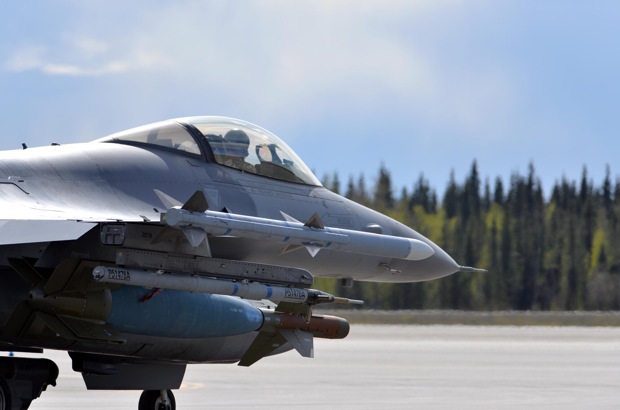 A U.S. Air Force F-16 Fighting Falcon pilot assigned to the 80th Fighter Squadron out of Kunsan Air Base, Republic of Korea, taxis down the Eielson Air Force Base, Alaska, flight line May 5, 2016, in preparation for a RED FLAG-Alaska (RF-A) 16-1 afternoon mission. Wolf Pack pilots can sharpen their combat skills in the Joint Pacific Alaska Range Complex, which provides more than 67,000 square miles of airspace, one conventional bombing range and two tactical bombing ranges containing 510 different types of targets and 45 threat simulators, both manned and unmanned. (U.S. Air Force photo by Master Sgt. Karen J. Tomasik/Released)
