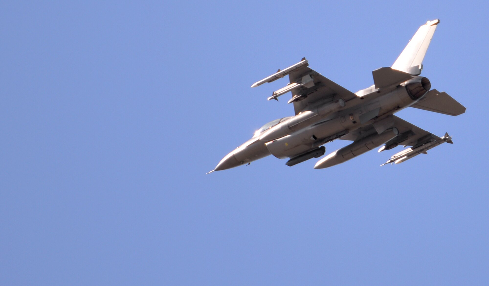 A U.S. Air Force F-16 Fighting Falcon assigned to the 80th Fighter Squadron out of Kunsan Air Base, Republic of Korea, flies over Eielson Air Force Base, Alaska, returning from a mission May 5, 2016, during RED FLAG-Alaska (RF-A) 16-1. RF-A is a series of Pacific Air Forces commander-directed field training exercises for U.S. and partner nation forces, enabling joint and international units to sharpen their combat skills by flying simulated combat sorties in a realistic threat environment inside the Joint Pacific Alaska Range Complex, the largest instrumented air, ground and electronic combat training range in the world. (U.S. Air Force photo by Master Sgt. Karen J. Tomasik/Released)