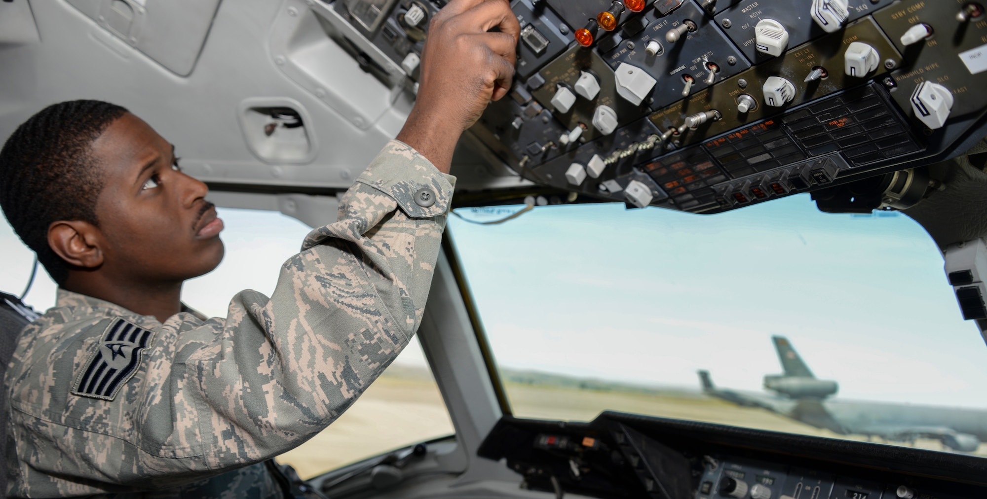 Staff Sgt. Terrell Cole, 660th Aircraft Maintenance Squadron communication/navigation mission systems craftsman, runs tests on the control panel of a KC-10 Extender at Travis Air Force Base, California. Cole troubleshoots aircraft discrepancies, repairs and inspects communication and navigation systems. (U.S. Air Force photo by Senior Airman Amber Carter)