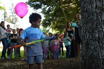 A child prepares to hit a piñata at the Team McChord Families Dinner May 10, 2016, at the Chapel Support Center on Joint Base Lewis-McChord, Wash. The event included dinner for families as well as entertainment and activities for the children. (U.S. Air Force photo/Staff Sgt. Naomi Shipley)