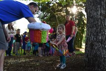 A child prepares to hit a piñata at the Team McChord Deployed Families Dinner May 10, 2016, at the Chapel Support Center on Joint Base Lewis-McChord, Wash. The dinner is hosted quarterly to support families of deployed members. (U.S. Air Force photo/Staff Sgt. Naomi Shipley)