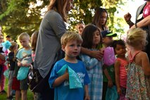 Children line up to hit a piñata at the Team McChord Deployed Families Dinner May 10, 2016, at the Chapel Support Center on Joint Base Lewis-McChord, Wash. The event’s theme was Cinco de Mayo and featured Mexican food as well as raffle and a toy give away. (U.S. Air Force photo/Staff Sgt. Naomi Shipley)