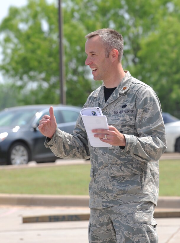 U.S. Air Force Maj. Kenneth Howell, 7th Munitions Squadron commander, announces the winning team of a bomb build competition April 29, 2016, at Dyess Air Force Base, Texas. The competition is designed to test new graduates of the Combat Munitions Training Planning Course on their skills as individuals and team members. (U.S. Air Force photo by Airman 1st Class Rebecca Van Syoc/Released)