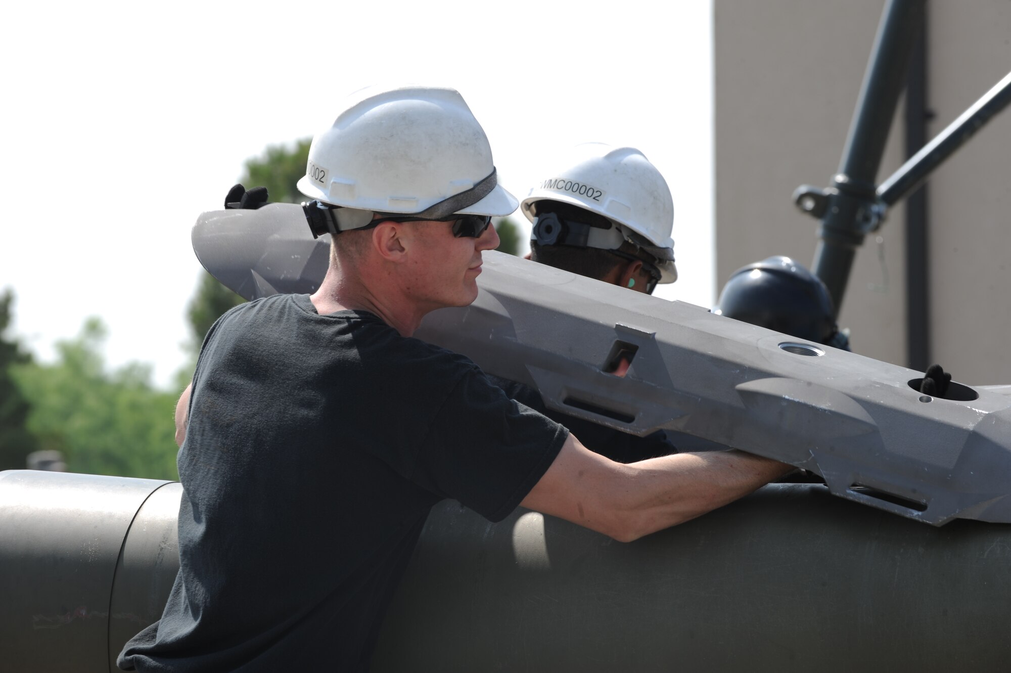 U.S. Air Force Senior Airman Chase Wood, 7th Munitions Squadron munitions controller, installs a hardback to an inert GBU-31 V3 joint direct attack munition as part of a bomb build competition April 29, 2016, at Dyess Air Force Base, Texas. As part of the competition, teams completed a build of six inert guided bomb units. (U.S. Air Force photo by Airman 1st Class Rebecca Van Syoc/Released)