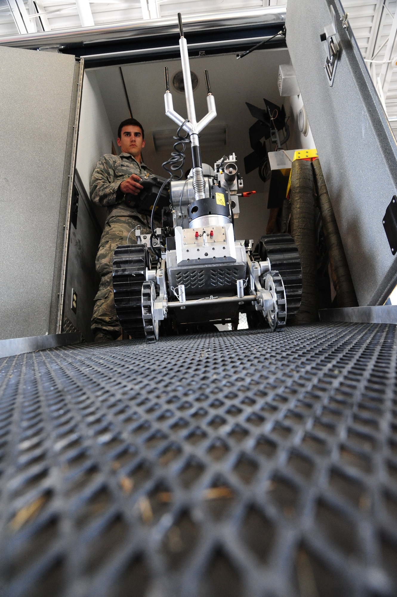U.S. Air Force Airman 1st Class Conner Walsh, a 509th Civil Engineer Squadron explosive ordnance disposal (EOD) team member, controls an HD2 robot on an EOD response vehicle at Whiteman Air Force Base, Mo., May 10, 2016. When the EOD team receives a response call regarding a suspicious package, they deploy a robot downrange to investigate the device. (U.S. Air Force photo by Airman 1st Class Keenan Berry)