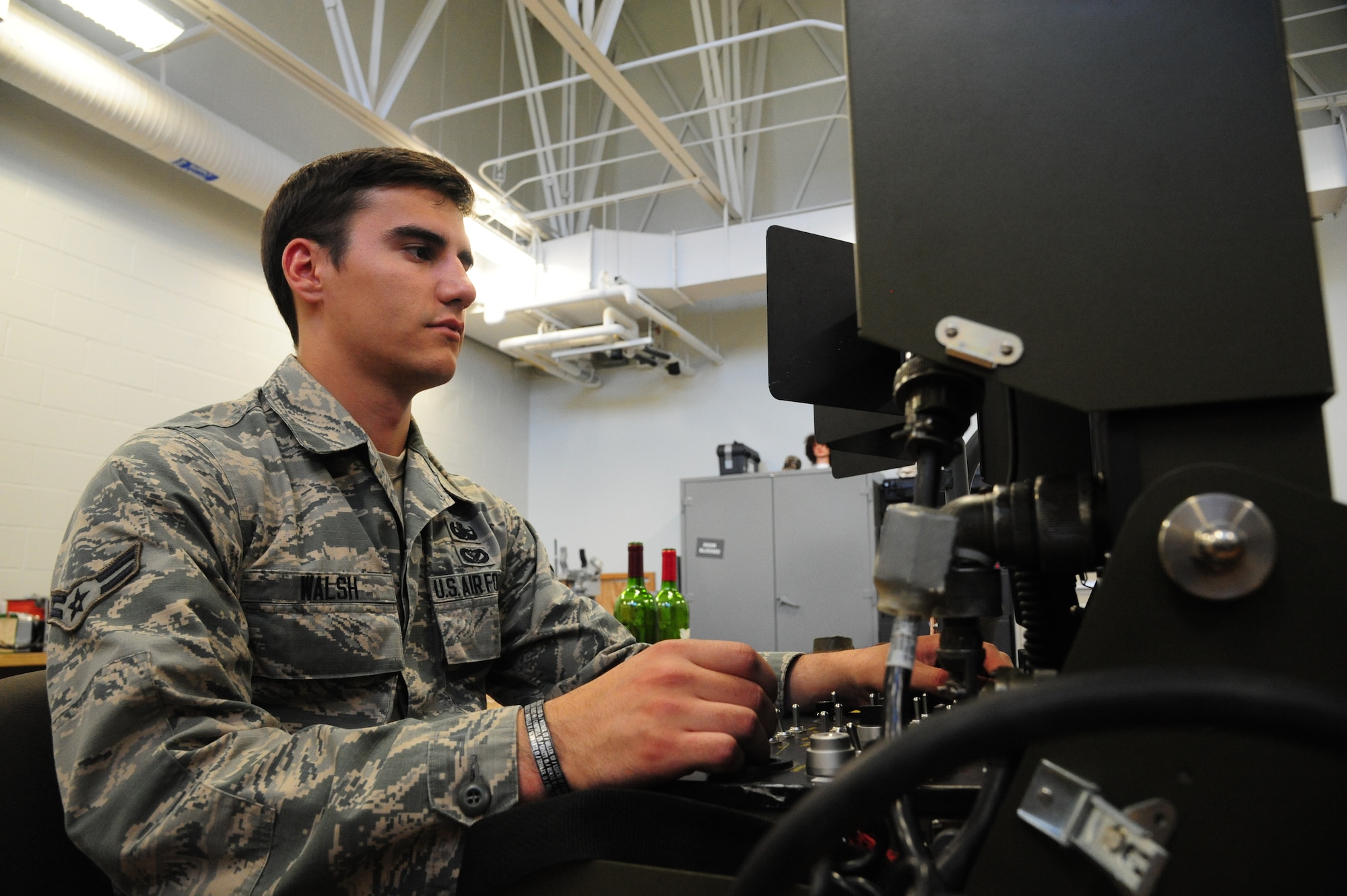 U.S. Air Force Airman 1st Class Conner Walsh, a 509th Civil Engineer Squadron explosive ordnance disposal team member, operates an F6A robot controller at Whiteman Air Force Base, Mo., May 10, 2016. The controller enables the robot to climb and maneuver around different obstacles as well as disarm explosive devices. (U.S. Air Force photo by Airman 1st Class Keenan Berry)