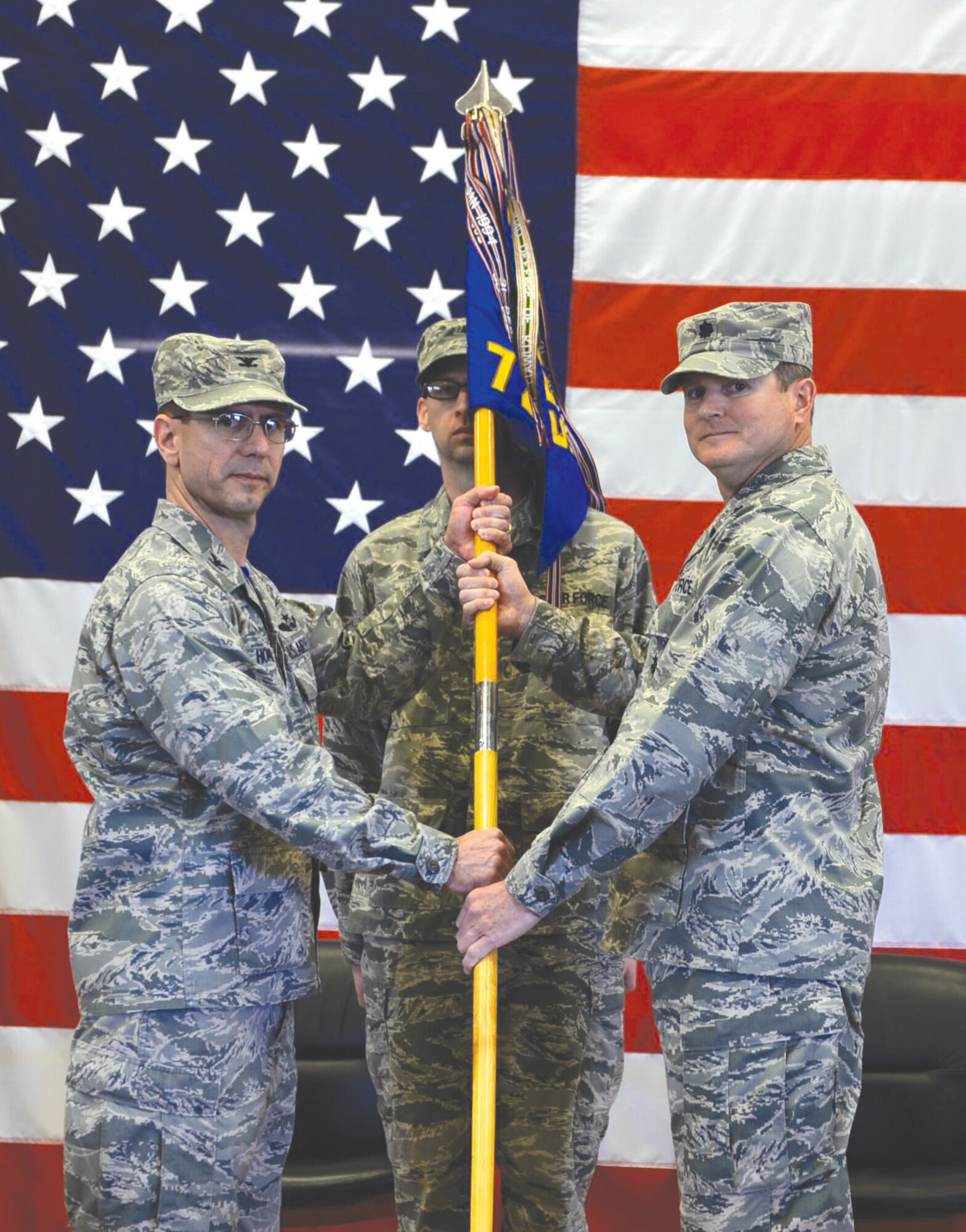Lt. Col. Sean Higgins, right, receives his unit’s guidon from Col. Michael Homola, 552nd Air Control Group commander, officially assuming command of the 726th Air Control Squadron during an April 22 ceremony attended by approximately 200 people at Mountain Home Air Force Base, Idaho. Colonel Higgins replaces Lt. Col. Ian Chambers, not pictured. Colonel Homola officiated the ceremony. The 726th ACS is a tenant unit of the 552nd ACG at Tinker AFB. The squadron’s responsible for mobile, decentralized command and control of joint operations by conducting threat warning, battle management, theater missile defense, weapons control, combat identification, and strategic communications. The 726th ACS is one of three USAF active-duty CRCs stationed in the United States. In recent years, “Hardrockers” have deployed on a sustained one-to-one dwell ratio in support of Operations Iraqi and Enduring Freedom, Noble Eagle and Air Defense of Arabian Gulf. (Air Force photo by Airman 1st Class Chester Mientkiewicz/Released