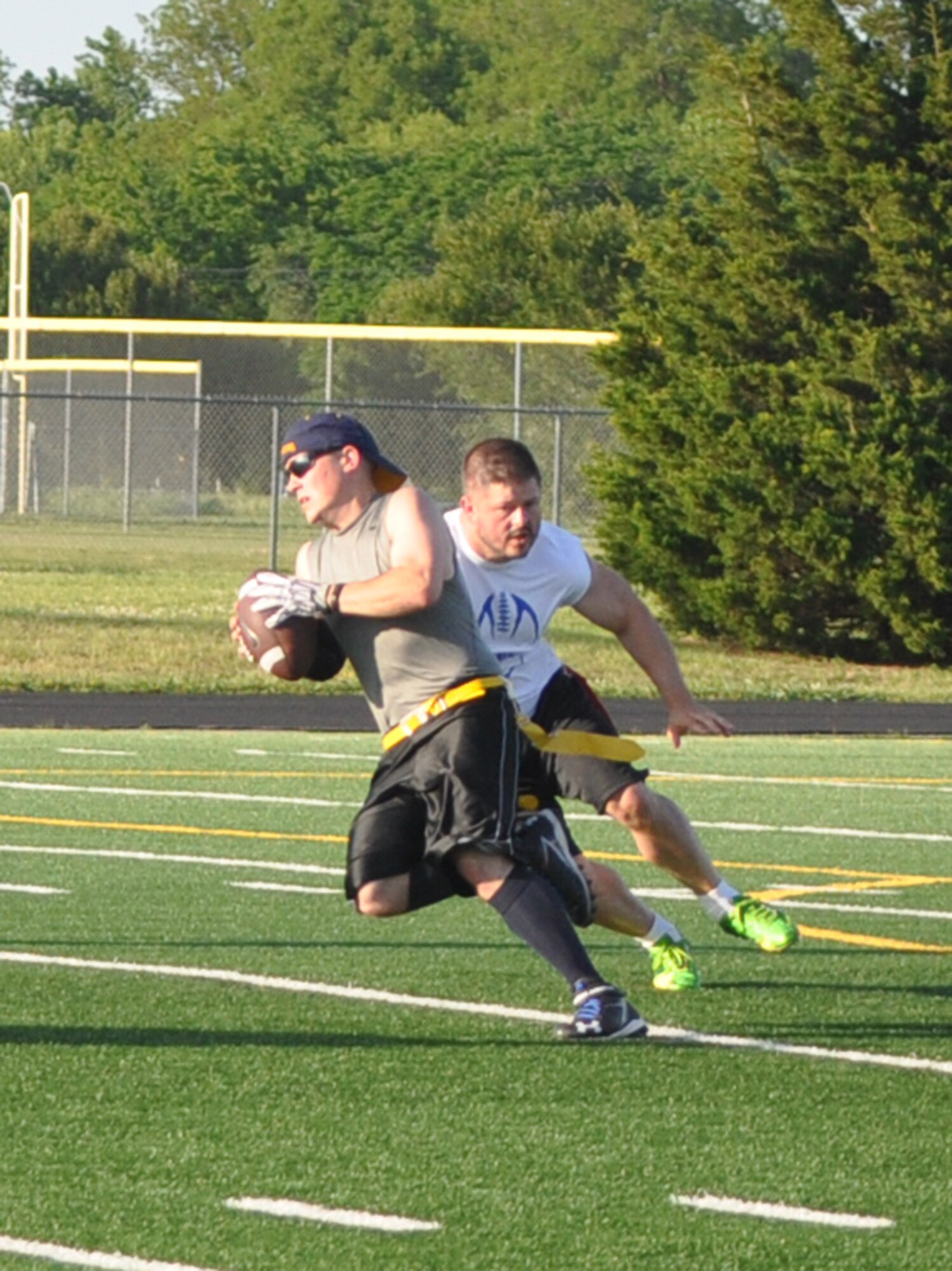 AMXS Eagles quarterback Adam Hall evades a tackler May 10 in a playoff game versus Reserve White. The Eagles, defending fall champions, sputtered on offense without their starting quarterback. Reserve White won 13-0.  (Air Force photo by John Parker/Released