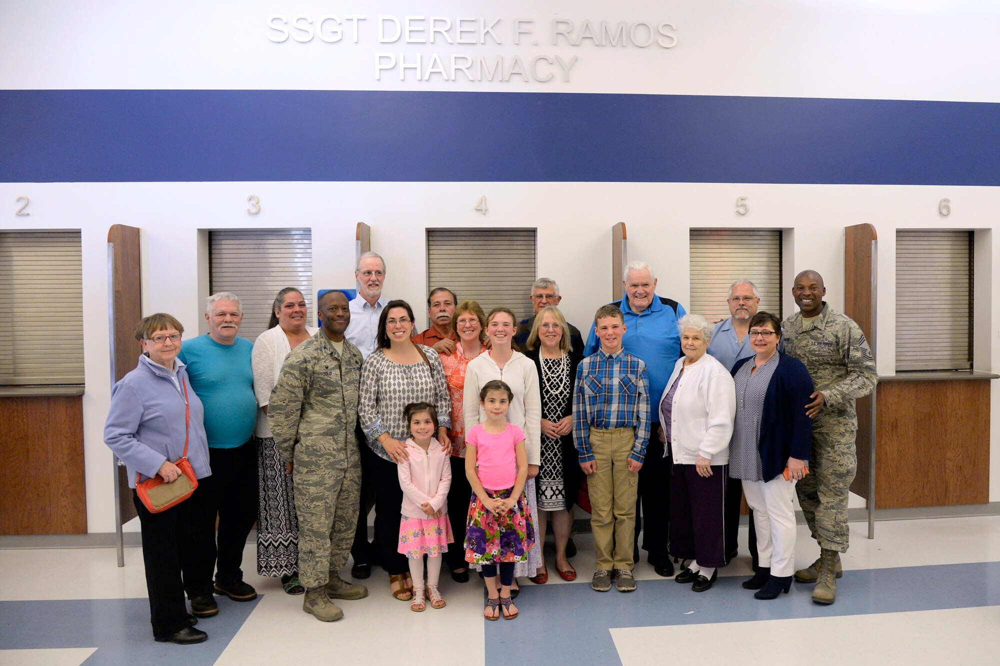 Col. Ronald Jolly, 75th Air Base Wing commander and Chief Master Sgt. Daniel McCain, pharmacy technician career field manager, join Staff Sgt. Derek F. and Emily Ramos’s family members at Hill Air Force Base’s newly renamed “Staff Sgt. Derek F. Ramos Pharmacy,” May 11, 2016. Ramos was instrumental in establishing the satellite pharmacy before he and his wife Emily were involved in a fatal vehicle accident last year. (U.S. Air Force photo by Todd Cromar)
