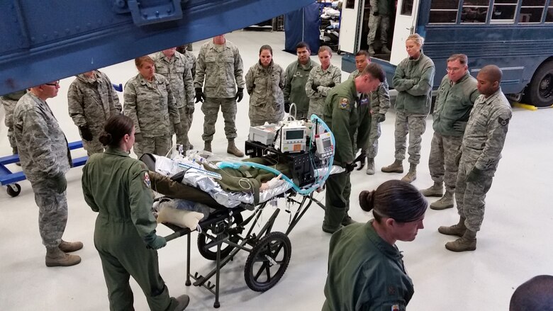 Students from the United States Air Force School of Aerospace Medicine Flight Nurse and Aeromedical Evacuation Technician Course, Class 2016D practice moving a patient from the C-17 trainer April 7. (U.S. Air Force photo/Bryan Ripple)