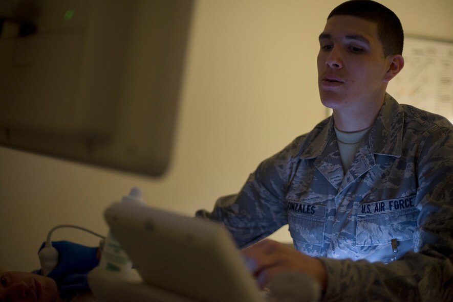 Staff Sgt. Manuel Gonzales, 374th Surgical Operations Squadron ultrasound technician, examines the readout on Philips Epiq 7 ultrasound system at Yokota Air Base, Japan, May 11, 2016. In addition to identifying internal injuries with X-rays and ultrasound, the diagnostic imaging flight also supports obstetrics, gynecology and orthotics. (U.S. Air Force photo by Senior Airman David C. Danford/Released)