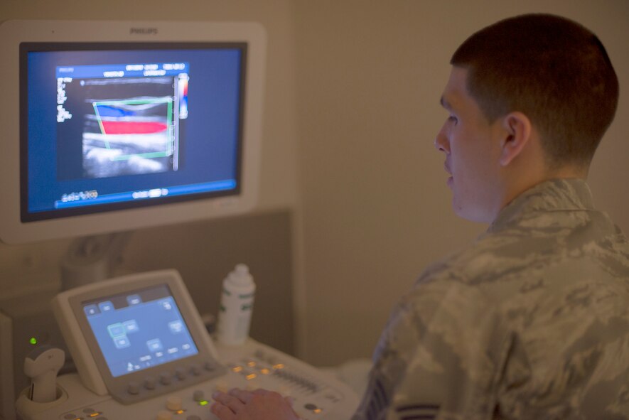 Staff Sgt. Manuel Gonzales, 374th Surgical Operations Squadron ultrasound technician, performs a carotid arterial ultrasound at Yokota Air Base, Japan, May 11, 2016. The radiology flight performs more than 5,200 exams annually, supporting the base mission by ensuring medical readiness. (U.S. Air Force photo by Senior Airman David C. Danford/Released)