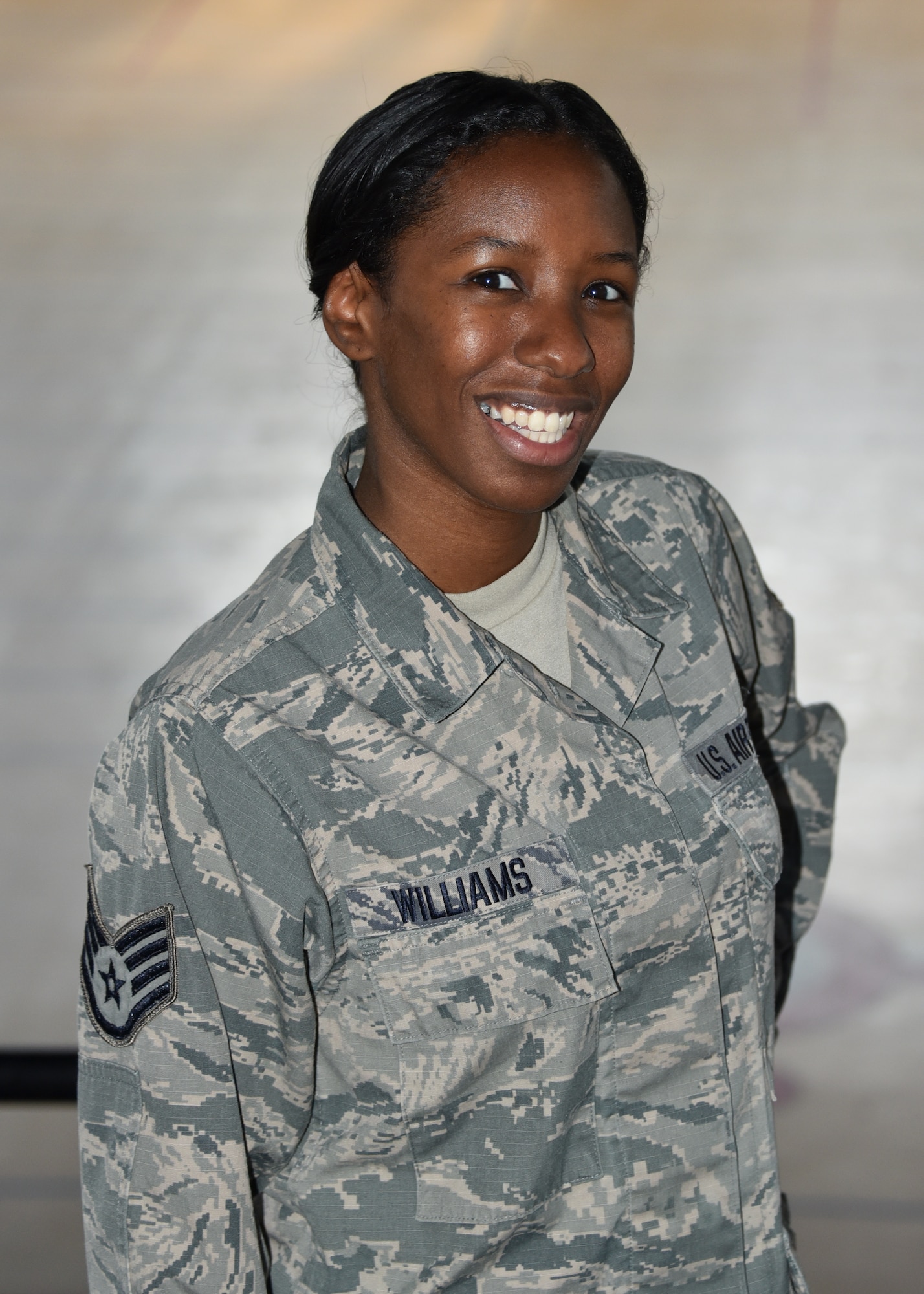 Staff Sgt. Chenelle Williams, Human Resource Specialist at Joint Force Headquarters, poses at the Fifth Regiment Armory, Baltimore, Md. Williams is the Maryland Air National Guard May Spotlight Airman. (U.S Air National Guard Photo by Senior Master Sgt. Ed Bard/RELEASED)