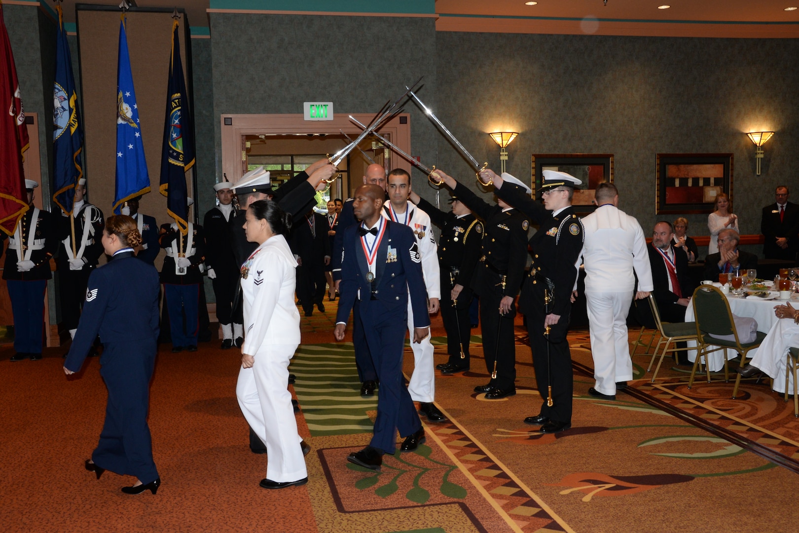 Nominees enter the ball room during the 2015 U.S. Strategic Command (USSTRATCOM) Annual Awards ceremony, Omaha, Neb., May 13, 2016. More than 80 nominees, military members and civilians, from USSTRATCOM's headquarters, functional components and task forces attended the ceremony after being recognized within their respective units for outstanding support to the command's global strategic missions. Prior to the award presentations, each nominee was recognized during a medallion presentation ceremony. One of nine DoD unified combatant commands, USSTRATCOM has global strategic missions, assigned through the Unified Command Plan, which include strategic deterrence; space operations; cyberspace operations; joint electronic warfare; global strike; missile defense; intelligence, surveillance and reconnaissance; combating weapons of mass destruction; and analysis and targeting. (USSTRATCOM photo by Steve Cunningham)