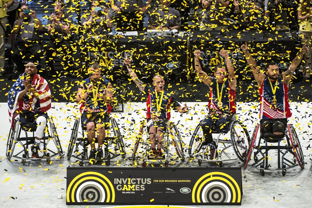 U.S. wheelchair basketball team members celebrate their gold medal win during the 2016 Invictus Games in Orlando, Fla., May 12, 2016. DoD photo by Edward Joseph Hersom II