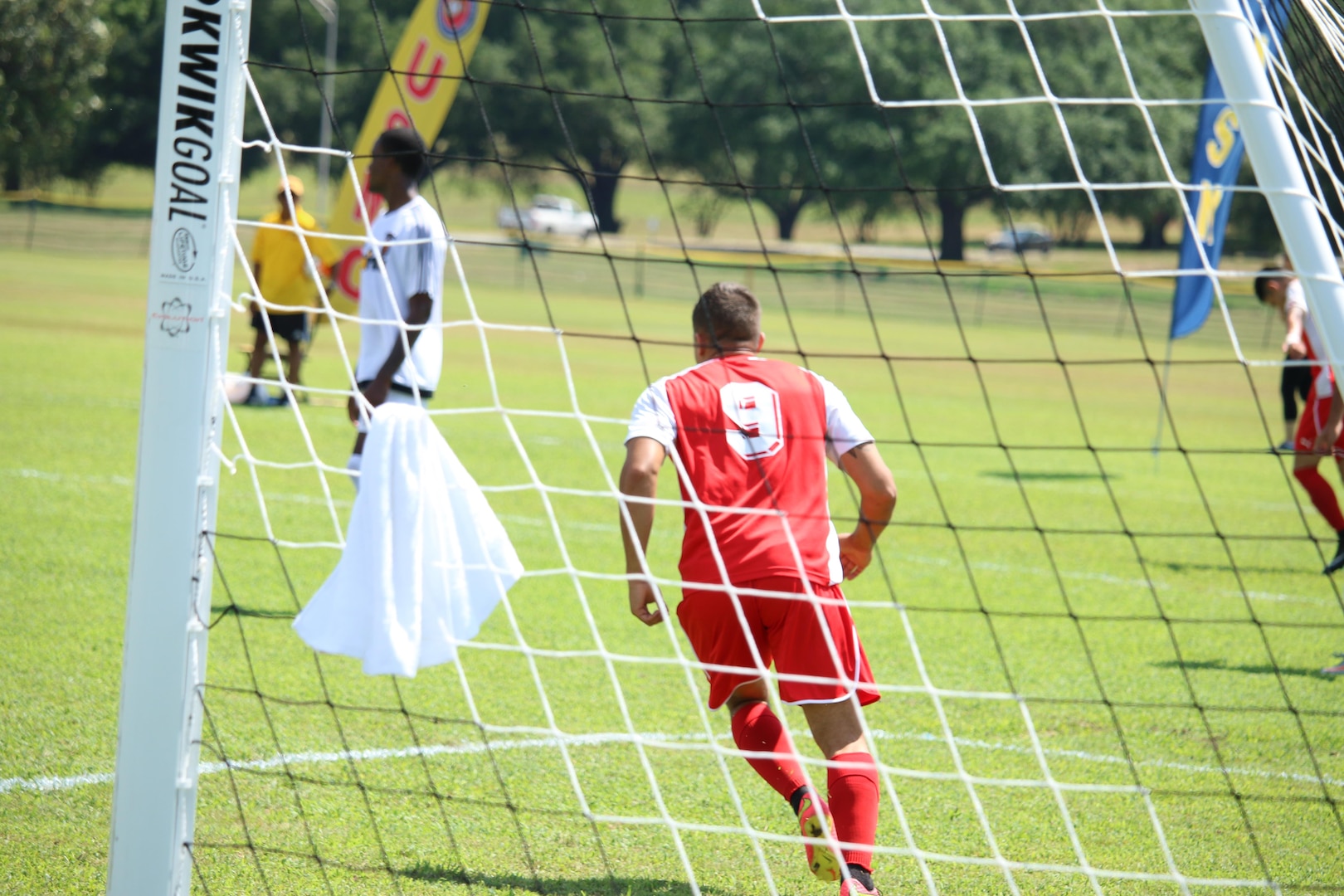 Fort Benning, Ga. - Marine Sgt Glenn Duffy (#9) celebrates after kicking the tying goal in the consolation match of the 2016 Armed Forces Men's Soccer Championship hosted at Fort Benning, Ga from 6-14 May 2016.  Marine Corps would go on to win the contest 3-2 to take third place.