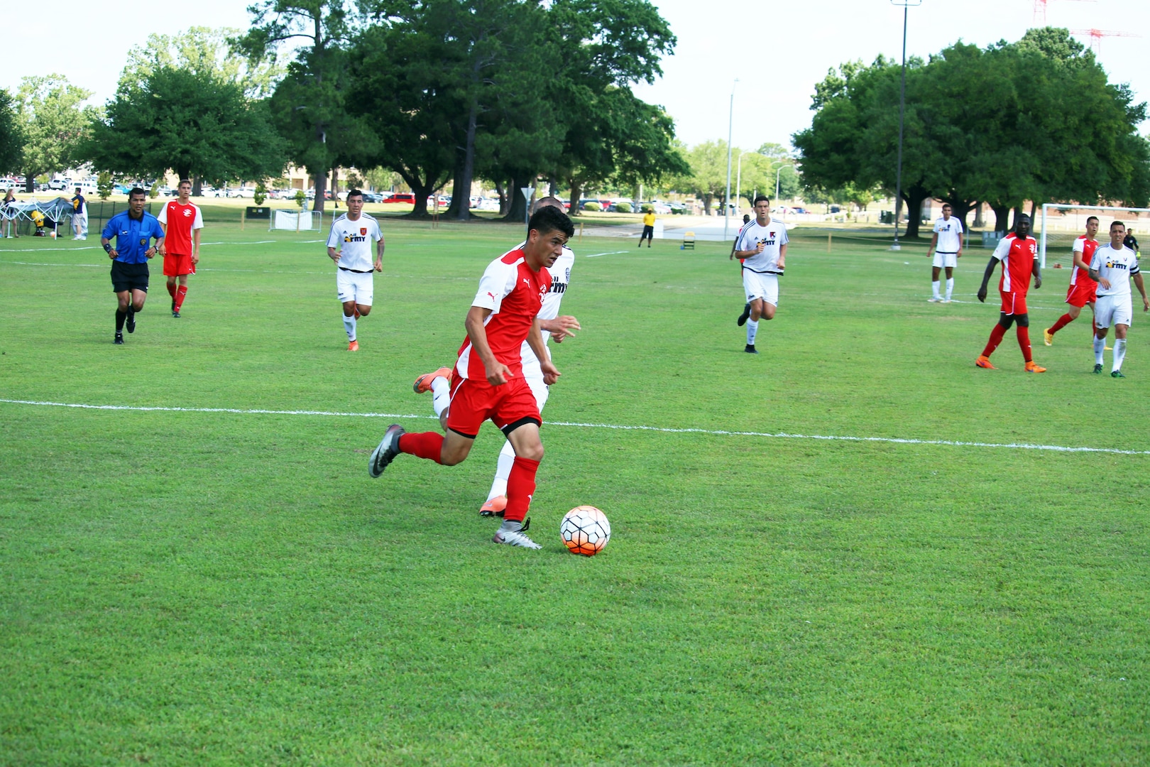 Fort Benning, Ga. - Marine Cpl Juan Medina drives to the goal to lift the Marines up from a 2-0 deficit in the consolation match of the 2016 Armed Forces Men's Soccer Championship hosted at Fort Benning, Ga from 6-14 May 2016.  Medina's goal would give the Marine Corps the win the contest 3-2 to take third place.