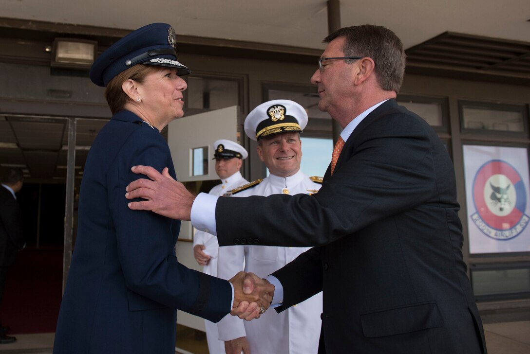 Defense Secretary Ash Carter exchanges greetings with Air Force Gen. Lori J. Robinson upon arriving for a change-of-command ceremony for the North American Aerospace Defense Command and U.S. Northern Command at Peterson Air Force Base, Colo., May 13, 2016. Robinson assumed leadership of NORAD and Northcom from Navy Adm. Bill Gortney, pictured center, during the ceremony. DoD photo by Air Force Senior Master Sgt. Adrian Cadiz