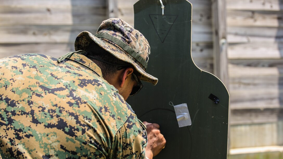 A Marine with 2nd Explosive Ordnance Disposal Company observes a target during a Protective Works Demolition Range at Marine Corps Base Camp Lejeune, North Carolina, May 12, 2016. After detonating the explosives, the EOD technicians traveled to the blast site to analyze the aftermath and collect data for future references. 