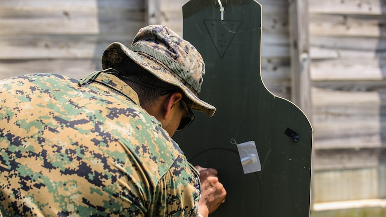 A Marine with 2nd Explosive Ordnance Disposal Company observes a target during a Protective Works Demolition Range at Marine Corps Base Camp Lejeune, North Carolina, May 12, 2016. After detonating the explosives, the EOD technicians traveled to the blast site to analyze the aftermath and collect data for future references. 
