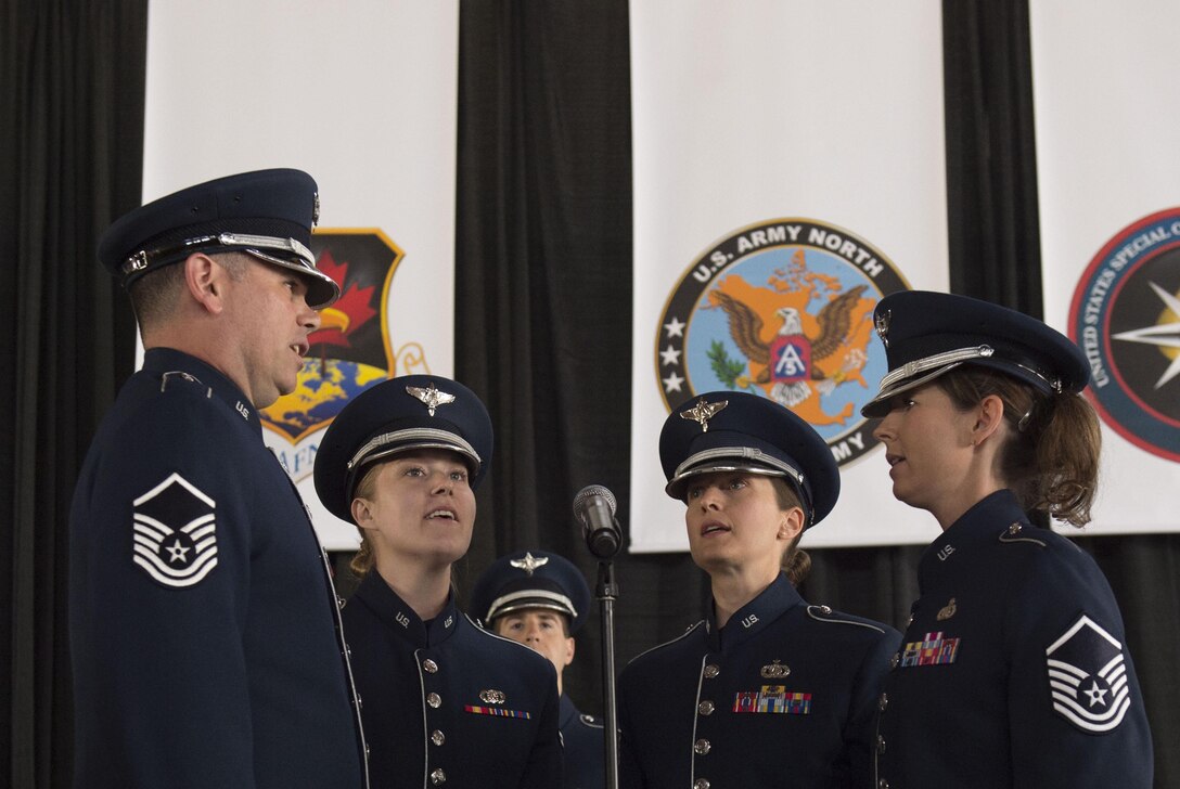 A group of Air Force vocalists sing the national anthem during the change-of-command ceremony for the North American Aerospace Defense Command and U.S. Northern Command at Peterson Air Force Base, Colo., May 13, 2016. DoD photo by Air Force Senior Master Sgt. Adrian Cadiz