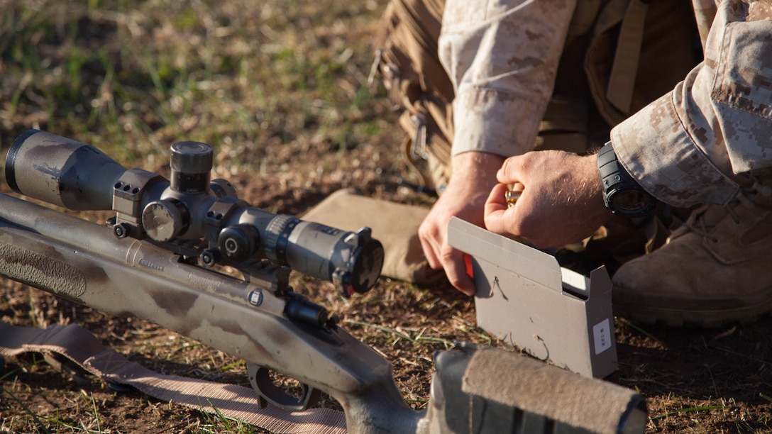 Cpl. John Luze, a competitor with the Marine Corps Shooting Team, loads a magazine before a practice fire with his M40A5 sniper rifle at Puckpunyal Military Area in Victoria, Australia, May 7, 2016. The M40A5 is a bolt-action sniper rifle that the Marine Corps uses for long-range enemy engagements.
