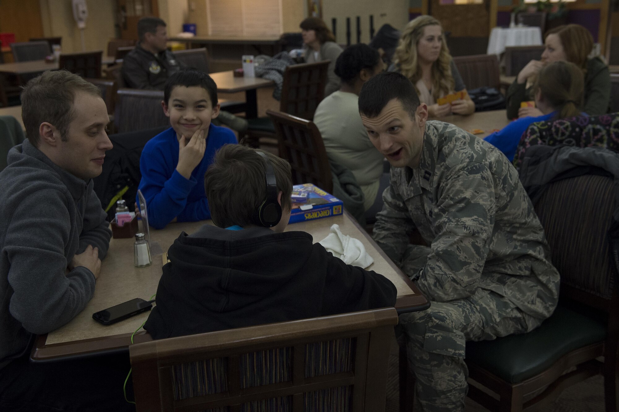 Capt. Dustin Schimp, 434th Communications Squadron director of operations Staff Sgt. Paul Harrington, 434th Communications Squadron cyber transport craftsman joke around with their “littles” during a  Big brother Big Sister event held here March 5. The program is being held here each Saturday during the unit training assembly to help foster positive relationships and mentorship to young lives. (U.S. Air Force/ Staff Sgt. Jami K. Lancette)