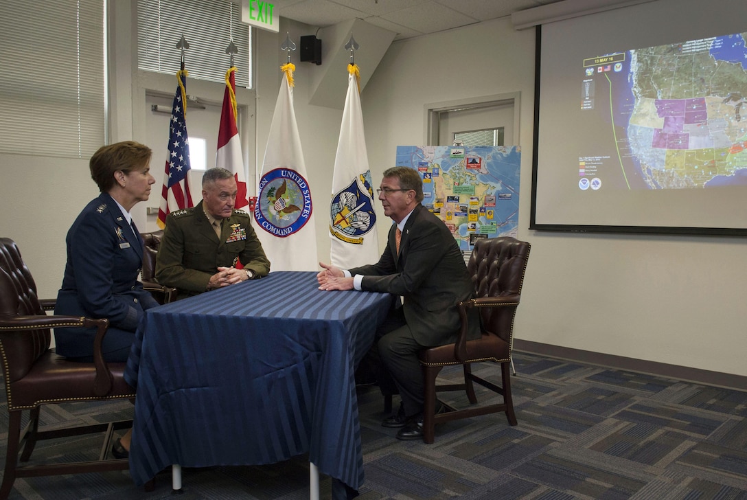 Defense Secretary Ash Carter and Marine Corps Gen. Joe Dunford, chairman of the Joint Chiefs of Staff, conduct a combatant command operations update with Air Force Gen. Lori J. Robinson following her assumption of command of the North American Aerospace Defense Command and U.S. Northern Command at Peterson Air Force Base, Colo., May 13, 2016. DoD photo by Air Force Senior Master Sgt. Adrian Cadiz