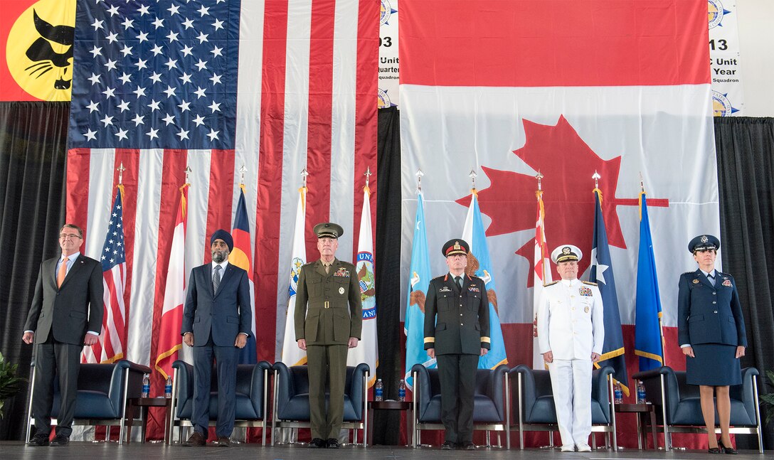 Members of the official party stand at the start of the change-of-command ceremony for the North American Aerospace Defense Command and U.S. Northern Command at Peterson Air Force Base, Colo., May 13, 2016. From left are Defense Secretary Ash Carter; Canadian Defense Minister Harjit Sajjan; U.S. Marine Corps Gen. Joe Dunford, chairman of the Joint Chiefs of Staff; Canadian Army Gen. Jonathan Vance, chief of the Canadian defense staff; Navy Adm. Bill Gortney, outgoing commander of NORAD and Northcom; and incoming commander Air Force Gen. Lori J. Robinson. DoD photo by Navy Petty Officer 2nd Class Dominique A. Pineiro