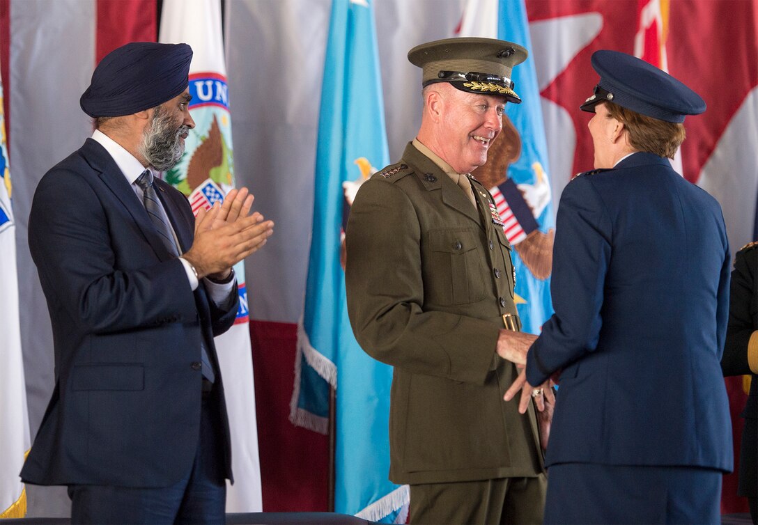 Marine Corps Gen. Joe Dunford, chairman of the Joint Chiefs of Staff, speaks with Air Force Gen. Lori J. Robinson after she formally assumed command of the North American Aerospace Defense Command and U.S. Northern Command during a ceremony at Peterson Air Force Base, Colo., May 13, 2016. Also pictured is Canadian Defense Minister Harjit Sajjan. DoD photo by Navy Petty Officer 2nd Class Dominique A. Pineiro