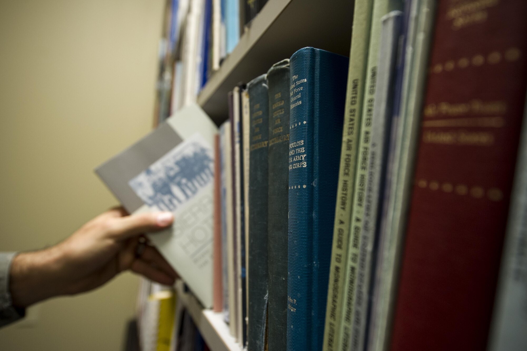 Staff Sgt. Mike Ziadeh, 434th Air Refueling Wing historian, organizes a combination of historical non-fiction novels and Air Force doctrine at Grissom Air Reserve Base, Indiana, April 9, 2016. Ziadeh joined the 434th ARW in February after previously serving as an aircraft maintenance technician in the Air National Guard. (U.S. Air Force photo/Staff Sgt. Katrina Heikkinen)