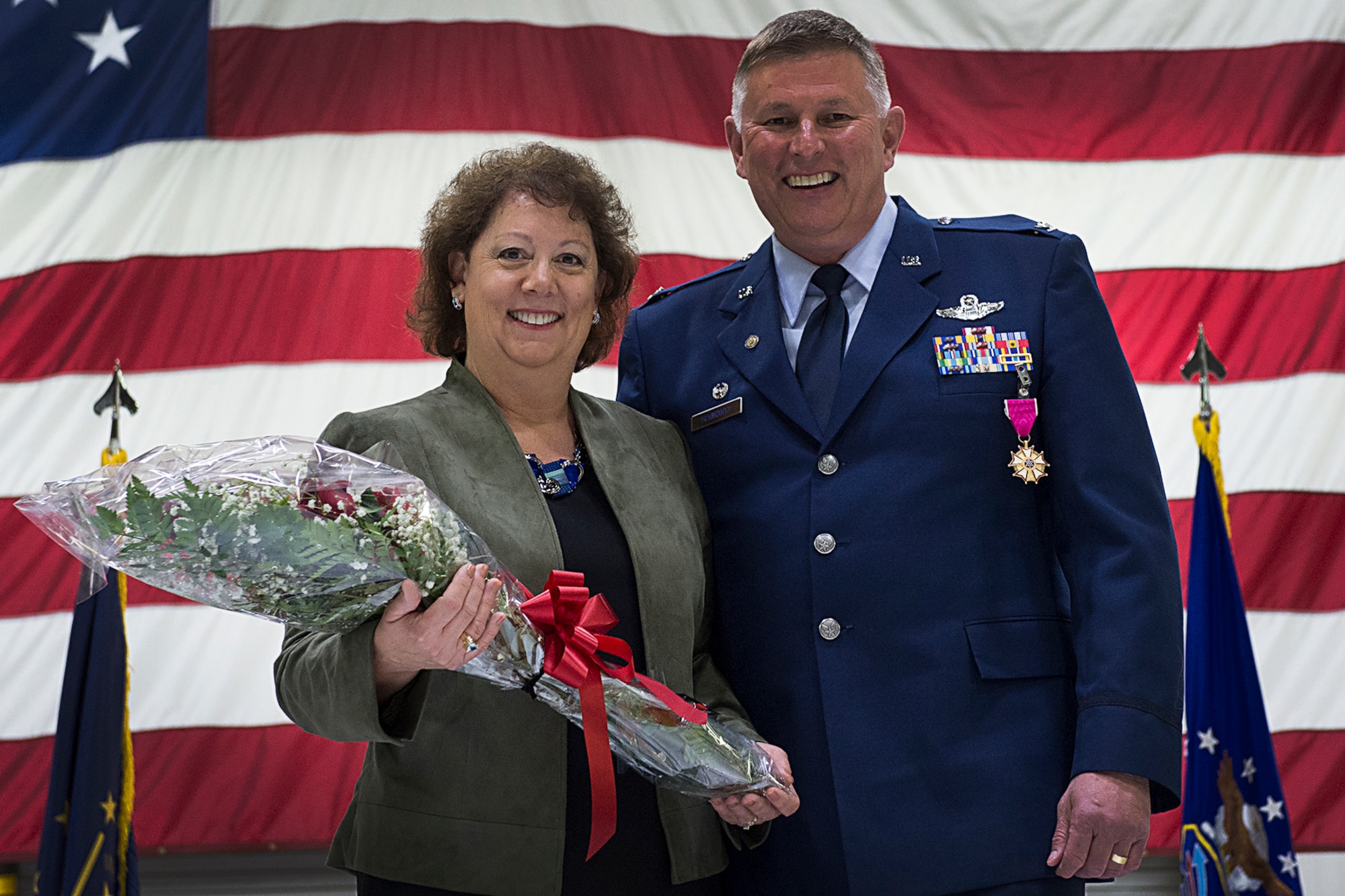 Col. Doug Schwartz, 434th Air Refueling Wing commander, poses for a photo with his wife Ann during a retirement ceremony at Grissom Air Reserve Base, Ind., May 14, 2016. Schwartz was joined by friends, family and coworkers to celebrate his retirement from the Air Force after 35 years of service. (U.S. Air Force photo/Staff Sgt. Katrina Heikkenin) 
