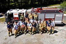 After a long day for live fire training, the 932nd Airlift Wing Civil Engineer Squadron, along with the 932nd AW commander, Col. Jonathan Philebaum and CES commander Peter Weilbach pose for a photo, May 14, 2016, Scott Air Force Base, Illinois. (U.S. Air Force photo by Tech. Sgt. Christopher Parr)