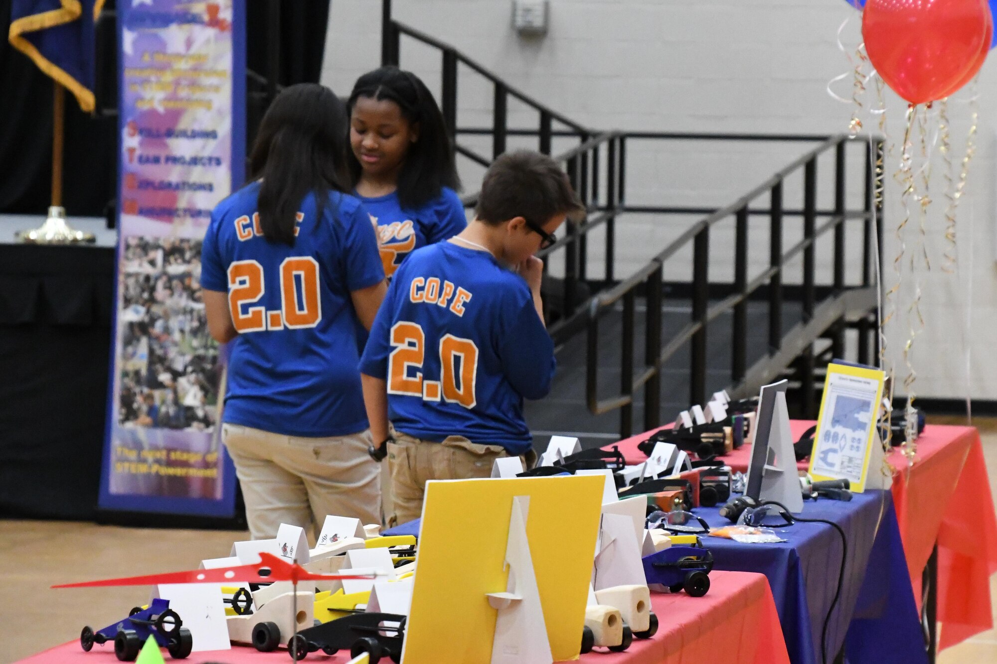 Students from Cope Middle School check out race cars powered by pressurized gas that were made during the STARBASE 2.0 after school program. The cars were displayed as part of the End of Year Celebration and Awards Ceremony held at Bossier Parish Community College in Bossier City, La., May 9, 2016. Students from three local middle schools were awarded with participation certificates and project awards following the completion of the year-long program. (U.S. Air Force photo by Master Sgt. Dachelle Melville/Released)