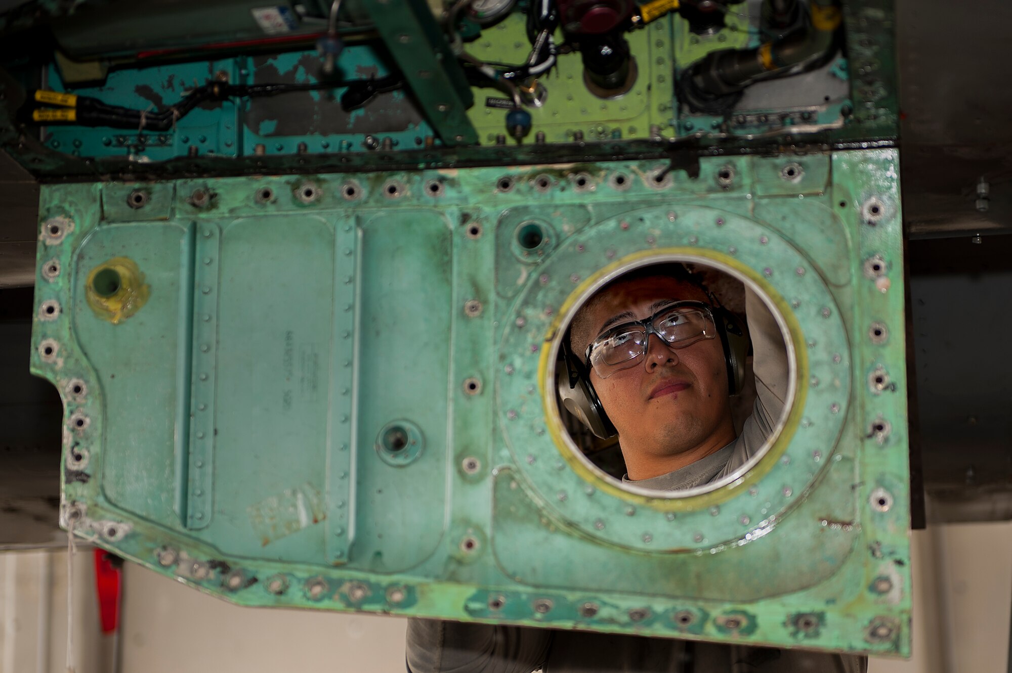 U.S. Air Force Senior Airman Clemente Velasco, 44th Aircraft Maintenance Unit dedicated crew chief, works to remove a faulty line out of an F-15E Eagle May 11, 2016, at Kadena Air Base, Japan. Crew chiefs work day and night to get broken aircraft back up in the air and back into the fight. (U.S. Air Force photo by Airman 1st Class Corey M. Pettis)