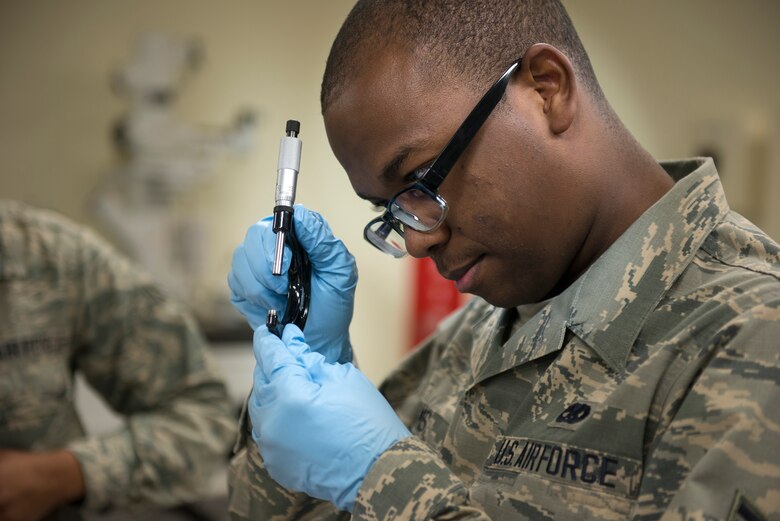 U.S. Air Force Airman 1st Class Michael Williams, 18th Component Maintenance Squadron test, measurement and diagnostic equipment technician, calibrates a micrometer May 10, 2016, at Kadena Air Base, Japan. Micrometers are used to measure small linear distances with great precision and are used by TMDE technicians to calibrate equipment. (U.S. Air Force photo by Senior Airman Omari Bernard)