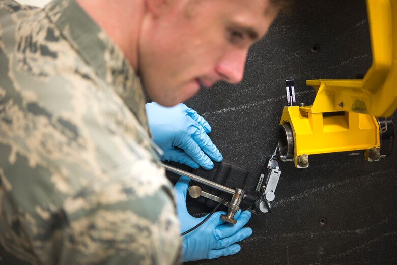 U.S. Air Force Staff Sgt. Benjamin Harvey, 18th Component Maintenance Squadron test, measurement and diagnostic equipment element supervisor, calibrates equipment used to align the guns of the F-15 Eagle May 10, 2016, at Kadena Air Base, Japan. The 18th CMS ensures the tools used by maintainers are calibrated so they can do their jobs and keep pilots safe. (U.S. Air Force photo by Senior Airman Omari Bernard)