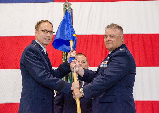 Col. Ken “Willie B” Eaves accepts the 131st Bomb Wing guidon from Maj. Gen. Gregory Champagne, Air National Guard assistant to the Air Force Global Strike Command commander, during the change of command ceremony at Whiteman Air Force Base, Mo., May 15, 2016. Eaves is now responsible for the Air National Guard’s only B-2 unit, which provides nearly 1,100 combat-ready Citizen-Airmen for both state and federal missions. (U.S. Air National Guard photo by Airman 1st Class Halley Burgess)