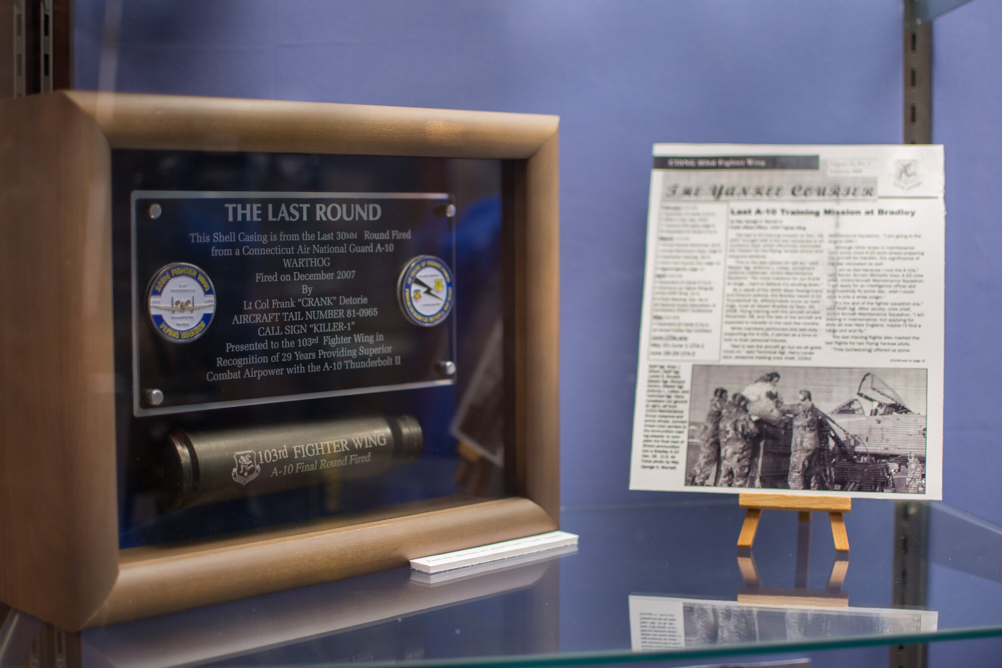 The Connecticut Air National Guard’s Flying Yankees are well into their 93rd year and the 103rd Heritage Collection located in the unit’s operations building has acquired an extensive compilation of photographs and artifacts. Recently, Maj. D. Elliotte Draegor, historian and director of inspections, assembled a display in the wing’s headquarters building outside of the dining facility. The display is comprised of various artifacts and stories she has come across in her research and it certainly catches your eye, telling the story of Gen. George P. Kane, the first person to enlist in the 118th Observation Squadron.
 (U.S. Air National Guard Photo by Airman 1st Class Sadie Hewes)