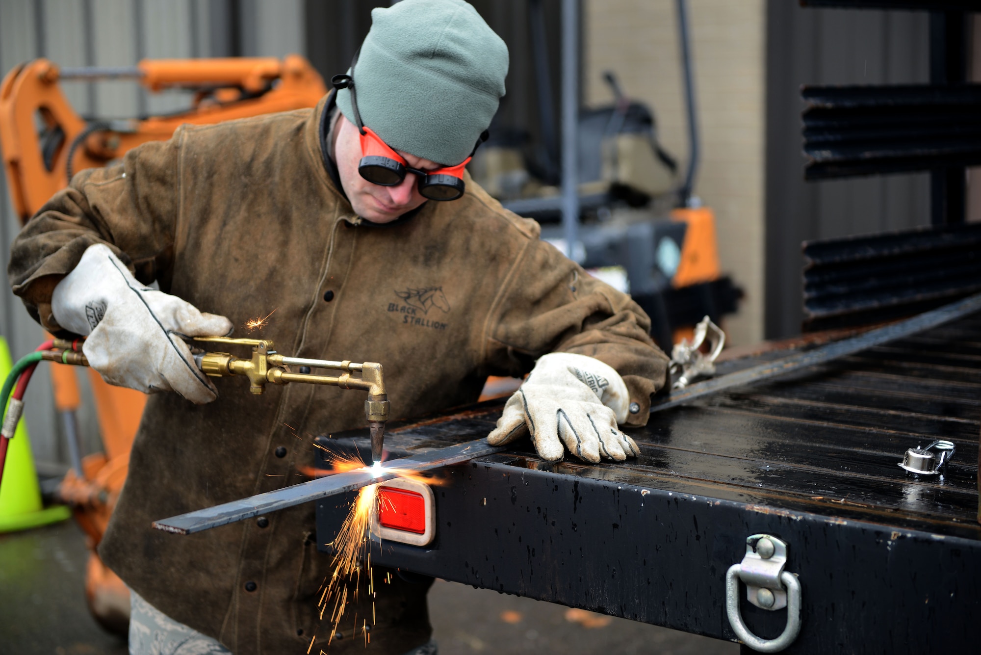 Senior Airman Eric Burton, a structural craftsman assigned to the 103rd Civil Engineer Squadron, slices through a piece of metal using an acetylene oxygen cutter on Bradley Air National Guard Base, East Granby, Conn., April 2, 2016. The metal being cut will be used to practice welding when the Flying Yankee craftsmen travel to Barnes Air National Guard base, Westfield, Mass., to sharpen their skills. (U.S. Air National Guard photo by Senior Airman Emmanuel Santiago)