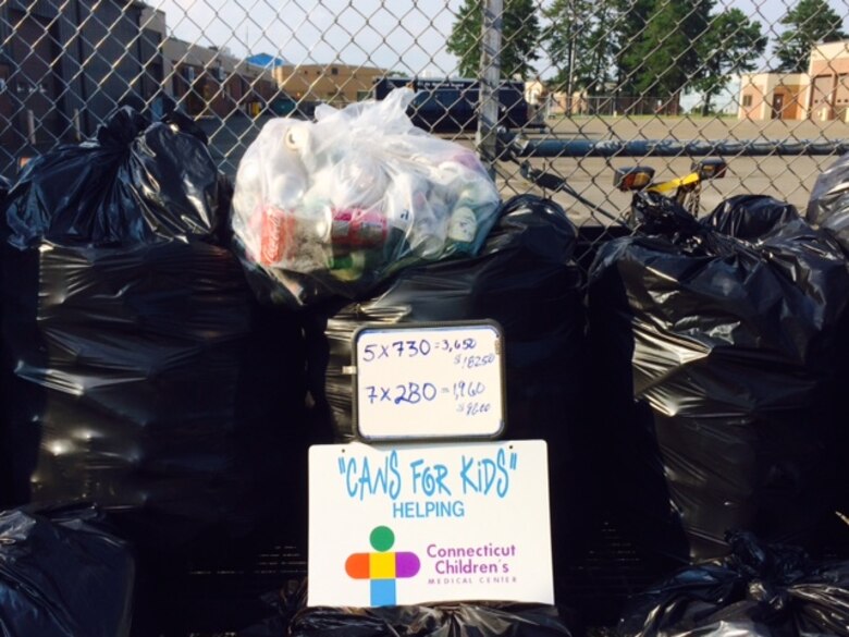 An impressive collection of bottles and cans is stacked against a fence on base at the home of the 103rd Airlift Wing’s Flying Yankees in East Granby, Conn., in late 2015. The bags are stacked in preparation for pickup and exchange for deposit reimbursement. Five years ago, Master Sgt. Nicola Nardi coordinated the first pick-up of recycled bottles and, since then, Nardi estimates that the collections from the base equate to about $1,000 per year being donated to the Connecticut Children’s Medical Center as part of the nonprofit Cans for Kids program. (Photo courtesy of Master Sgt. Nicola Nardi)