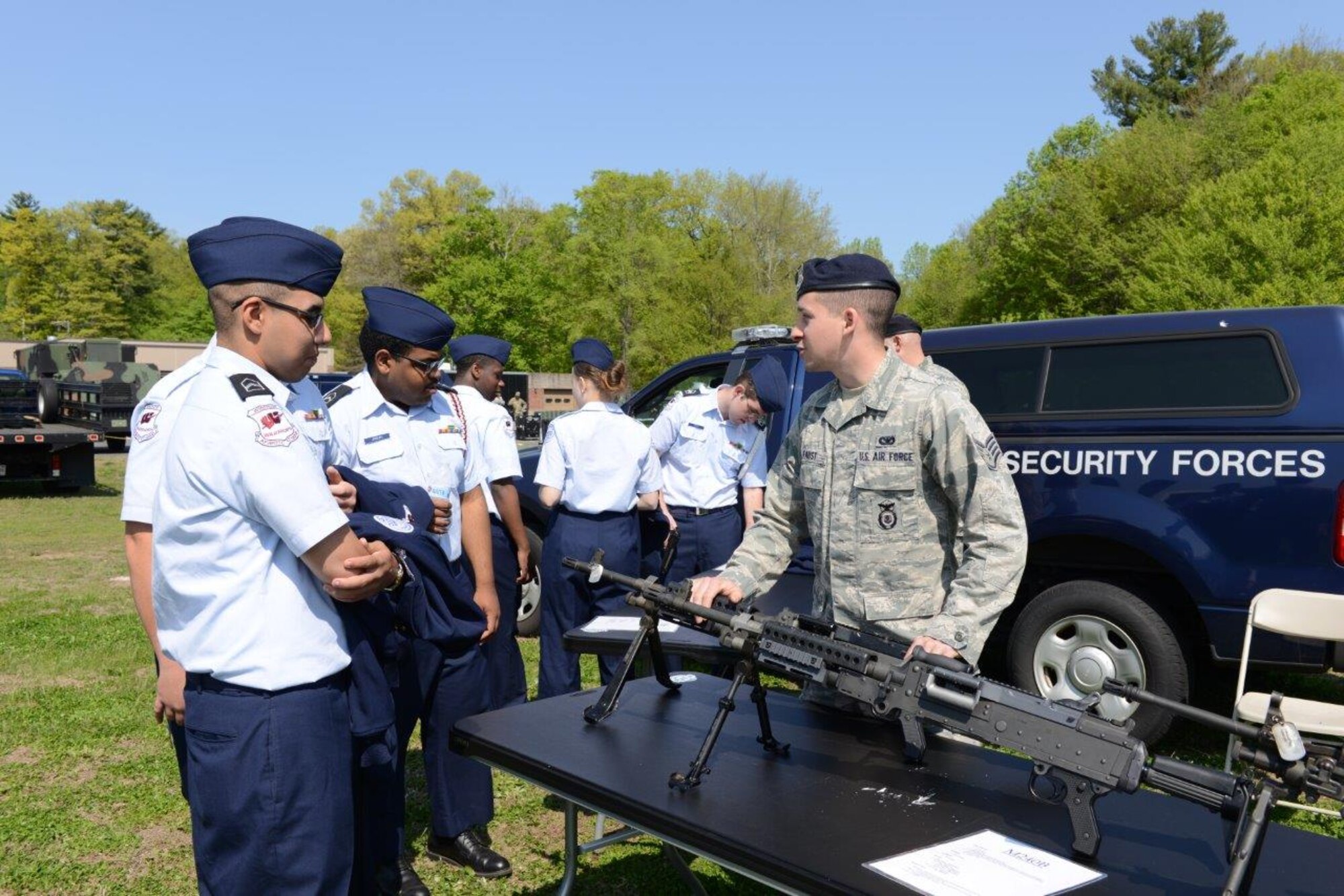 Staff Sgt. Andrew Faust, security forces specialist, explains safe use and handling of military-issued weapons to visiting Jr. R.O.T.C. students May 12, 2016, during a Career Day event hosted at Bradley Air National Guard Base, East Granby, Conn. The interaction with troops from the 103rd Security Forces Squadron was a highlight for students participating in Career Day events. (U.S. Air Force photo by Master Sgt. Erin McNamara)