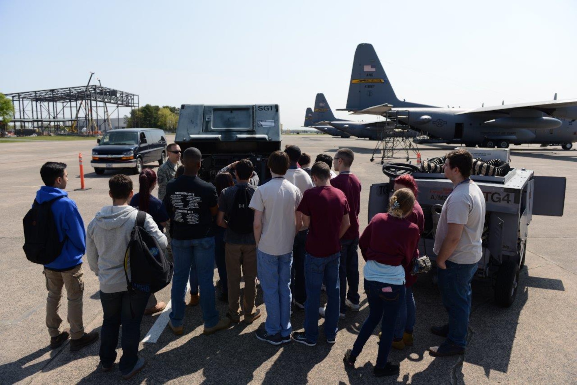 Master Sgt. Dennis Coughlin, aircraft ground equipment technician, explains the function and purpose of equipment to support flight mobility May 12, 2016, during a Career Day hosted at Bradley Air National Guard Base, East Granby, Conn. Students discussed military careers with Air National Guardsmen during their visit to the 103rd Airlift Wing. (U.S. Air Force photo by Master Sgt. Erin McNamara)