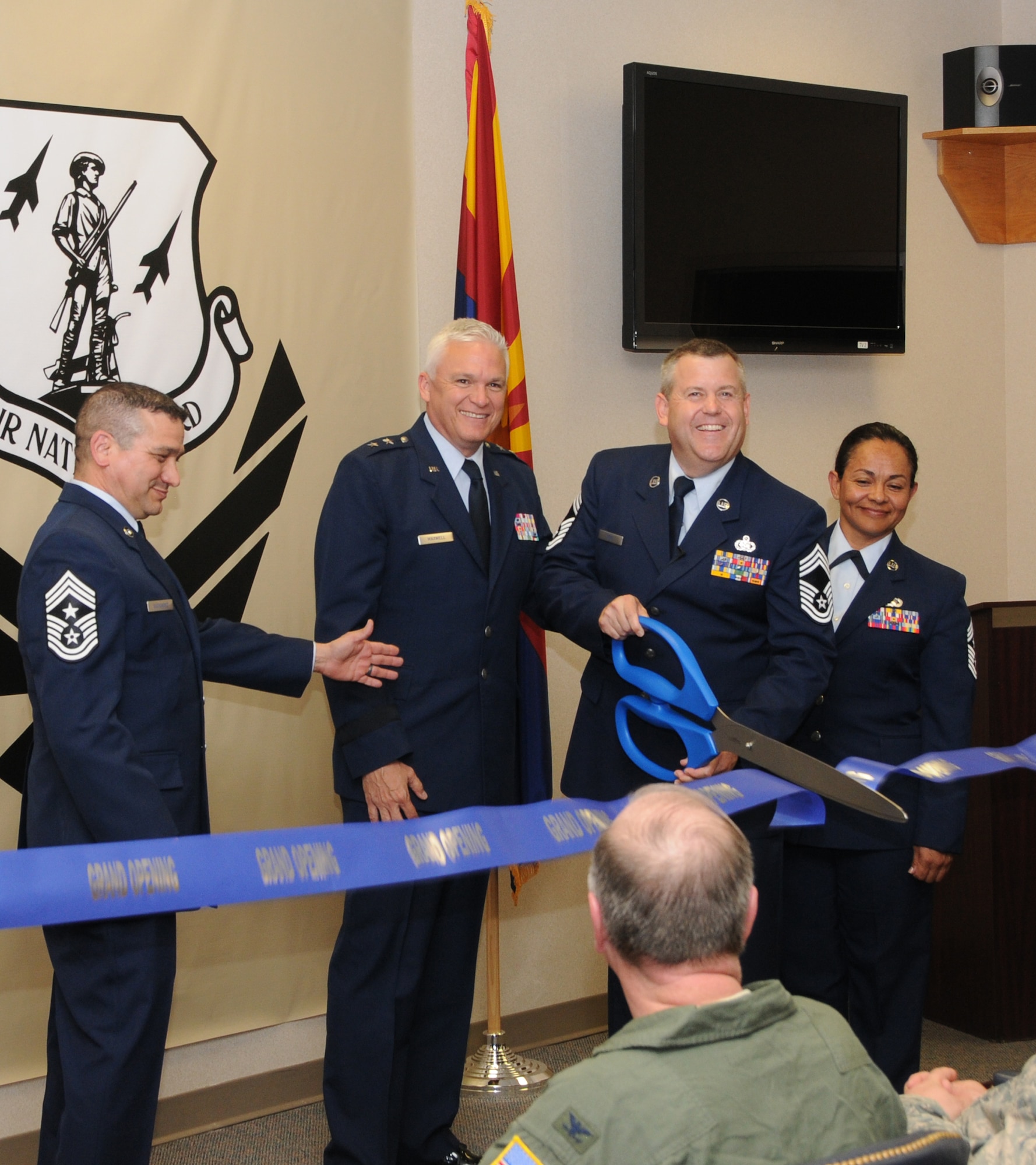 13. Maj. Gen. Edward Maxwell, commander of the Arizona Air National Guard, Chief Master Sgt. Daniel Gutierrez, state command chief master sergeant, Chief Master Sgt. Martha Garcia, 161st Air Refueling Wing command chief, and Chief Master Sgt. Bert Reid, 161st Logistics Readiness Squadron chief enlisted manager, commemorate the wing’s new Center for Enlisted Leadership and Learning at a ribbon cutting ceremony at the Phoenix Air National Guard base, May 15. The CELL will offer all wing enlisted Airmen the opportunity to participate in professional development and leadership training; aligning the wing with the strategic roadmap set forth by the Secretary of the Air Force.