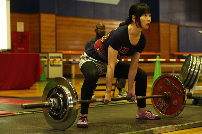 Kotono Ikagawa, an off-base resident from Fukuoka, Japan, prepares to deadlift during the 2016 Deadlift Competition held in the IronWorks Gymnasium at Marine Corps Air Station Iwakuni, May 14, 2016. Status of Forces Agreement members and Japanese off-base residents competed in their respective weight class for the ultimate deadlift title. This competition gave participants a chance to showcase their physical strength, dedication to fitness, drive to win, and gave more incentive for service members to push their physical capabilities in a positive, competitive atmosphere. (U.S. Marine Corps photo by Sgt. Jessica Quezada/Released)