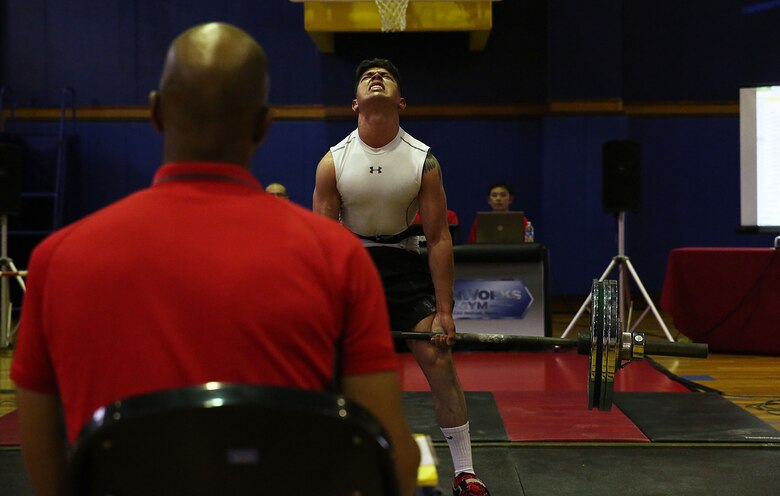 Lance Cpl. Carlos Leon, a crewmember with aircraft recovery, Headquarters and Headquarters Squadron, deadlifts during the 2016 Deadlift Competition at the IronWorks Gymnasium at Marine Corps Air Station Iwakuni, Japan, May 14, 2016. Status of Forces Agreement members and Japanese off-base residents competed in their respective weight class for the ultimate deadlift title. This competition gave participants a chance to showcase their physical strength, dedication to fitness, drive to win, and gave more incentive for service members to push their physical capabilities in a positive, competitive atmosphere. (U.S. Marine Corps photo by Sgt. Jessica Quezada/Released)